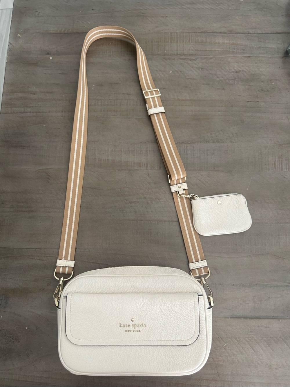 kate spade cream pebbled leather crossbody with tan striped strap